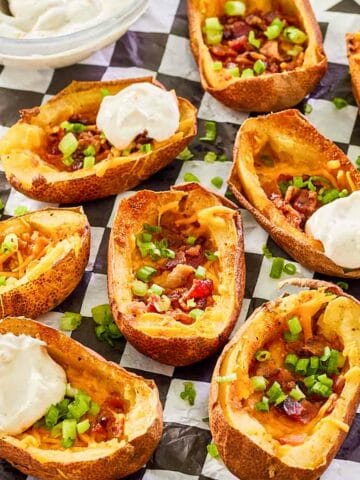 air fryer potato skins with sour cream ranch sauce.
