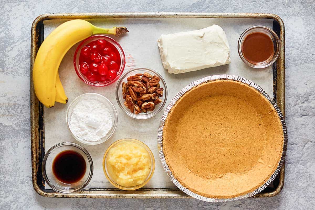 banana split pie ingredients on a tray.