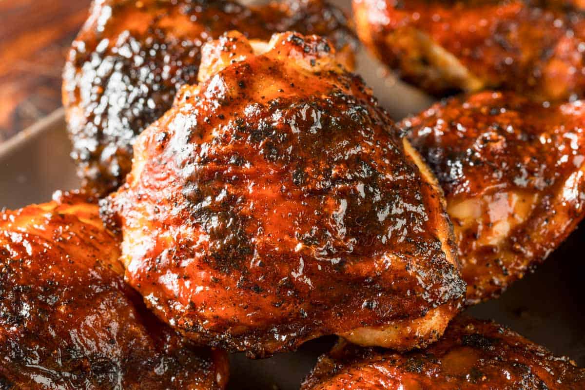closeup of grilled bbq chicken thighs.