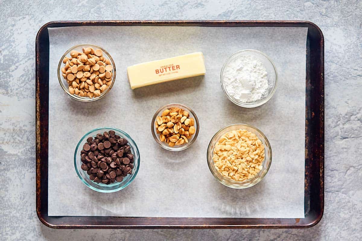 rice krispie peanut butter balls ingredients on a tray.
