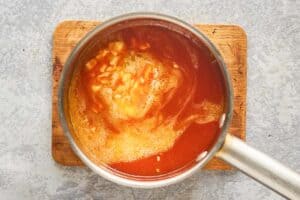 louisiana hot sauce wing sauce ingredients in a pan.