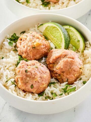 Asian pork meatballs and rice in a bowl.