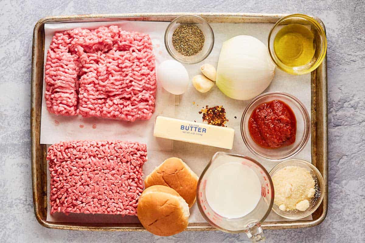 ingredients for meatball sliders on a tray.