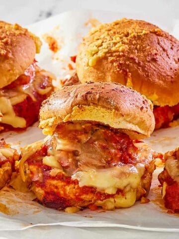meatball sliders on parchment paper.