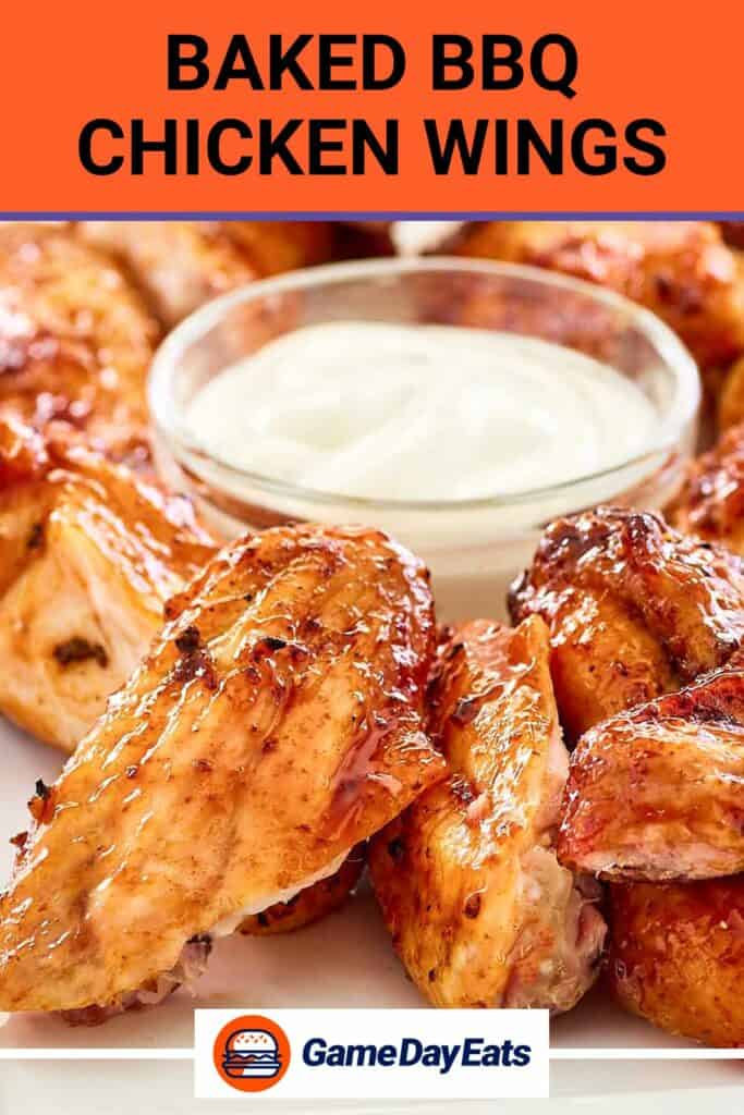 closeup of baked barbecue chicken wings and blue cheese dressing.