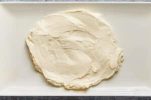 cream cheese mixture spread into a circle on a platter.
