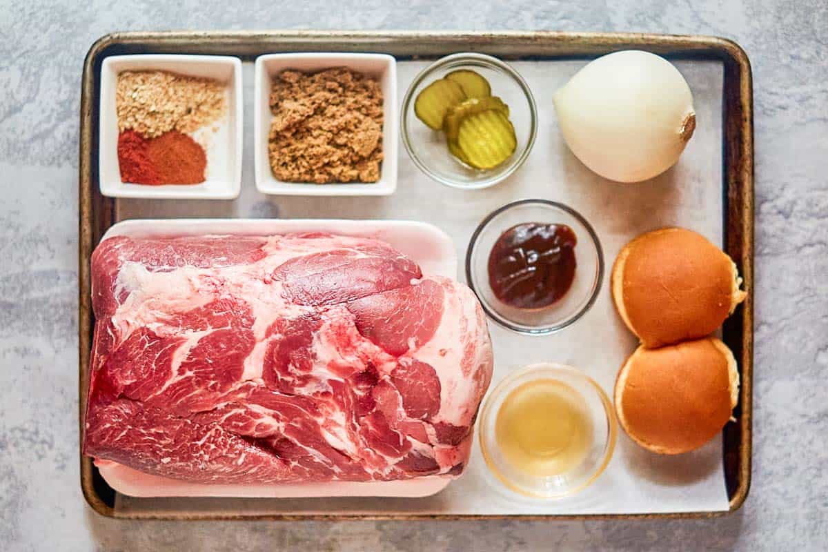 pulled pork sliders ingredients on a tray.