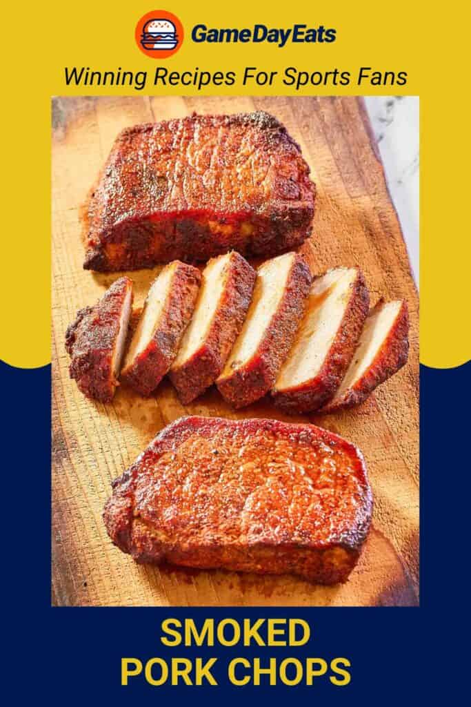 three seasoned and smoked pork chops on a wood cutting board.