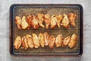 smoked dry rub chicken wings on a wire rack.