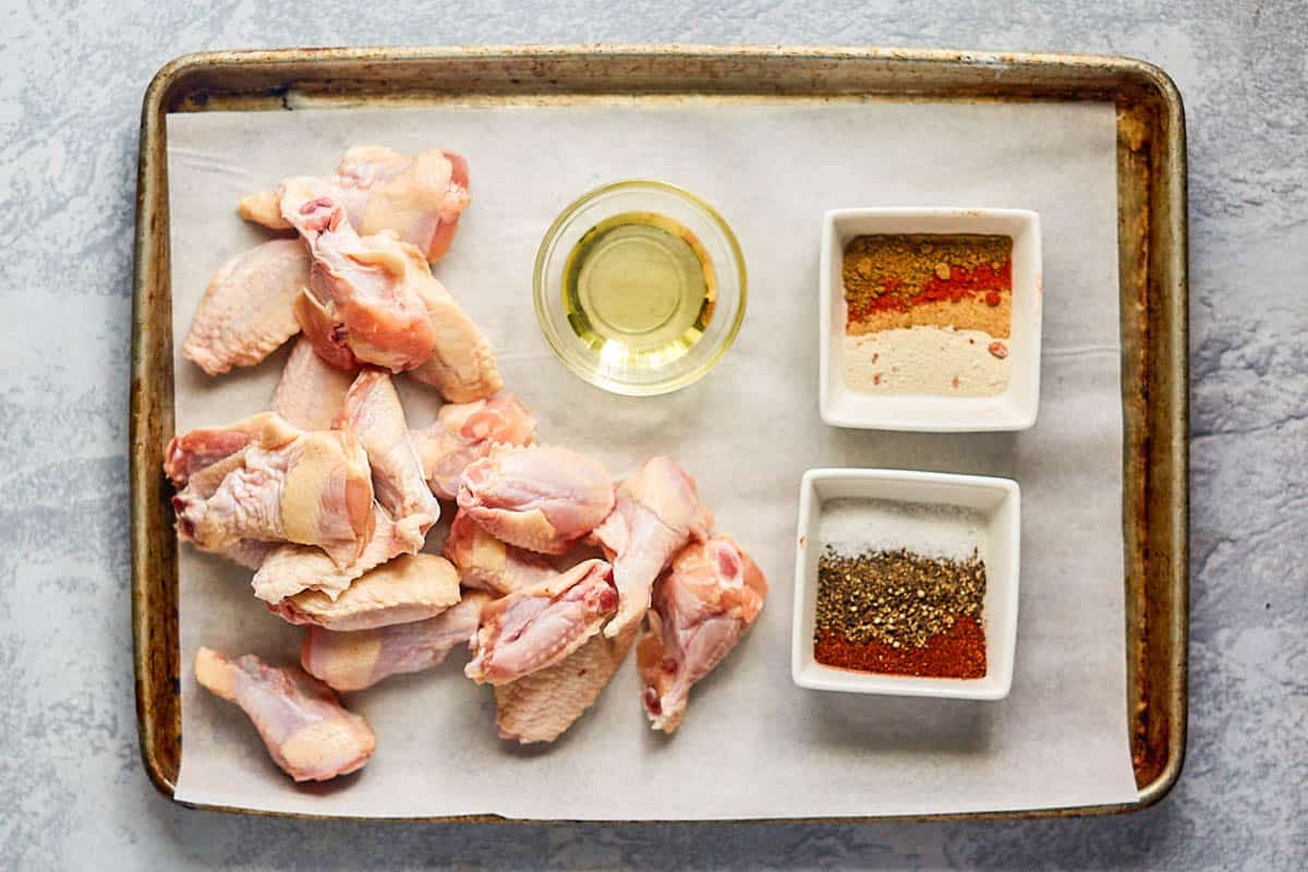 Dry rub smoked chicken wings ingredients on a tray.