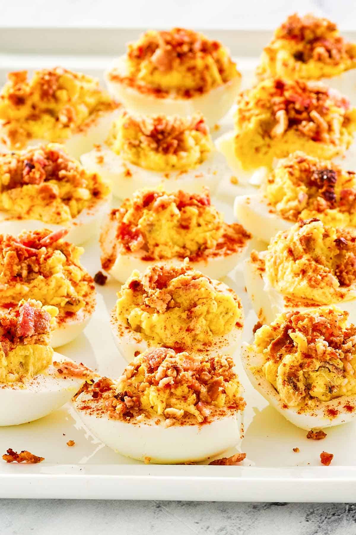 Bacon ranch deviled eggs on a platter.