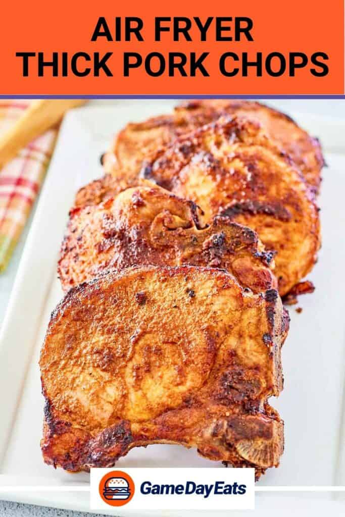 Air-fried thick pork chops on a platter.