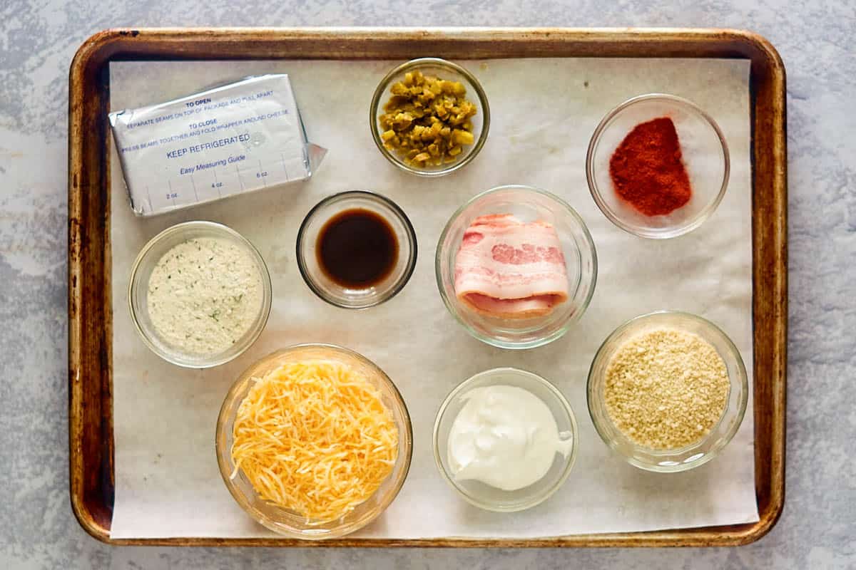 Jalapeno popper cheese ball ingredients on a tray.