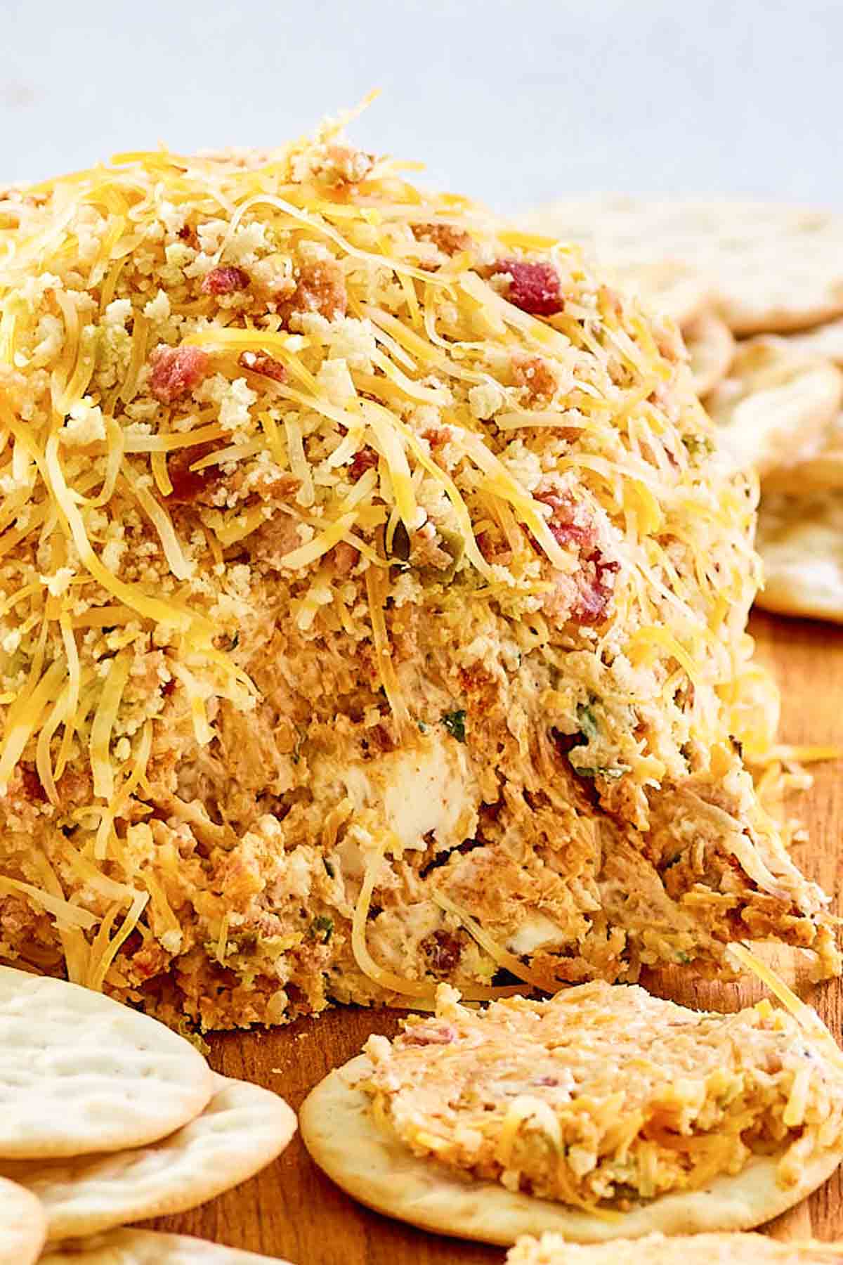 Closeup of a jalapeno popper cheese ball with bacon.