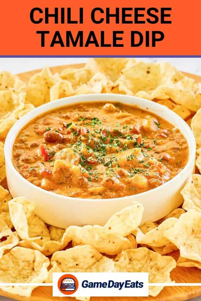 A bowl of chili cheese tamale dip on a platter with tortilla chips.