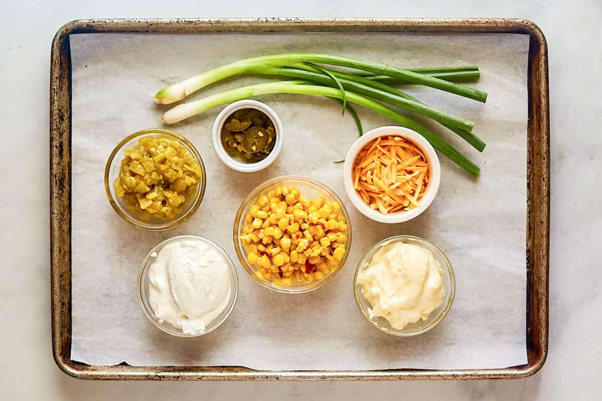Corn chip dip ingredients on a tray.