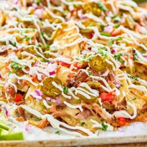 Pulled pork nachos loaded with toppings.