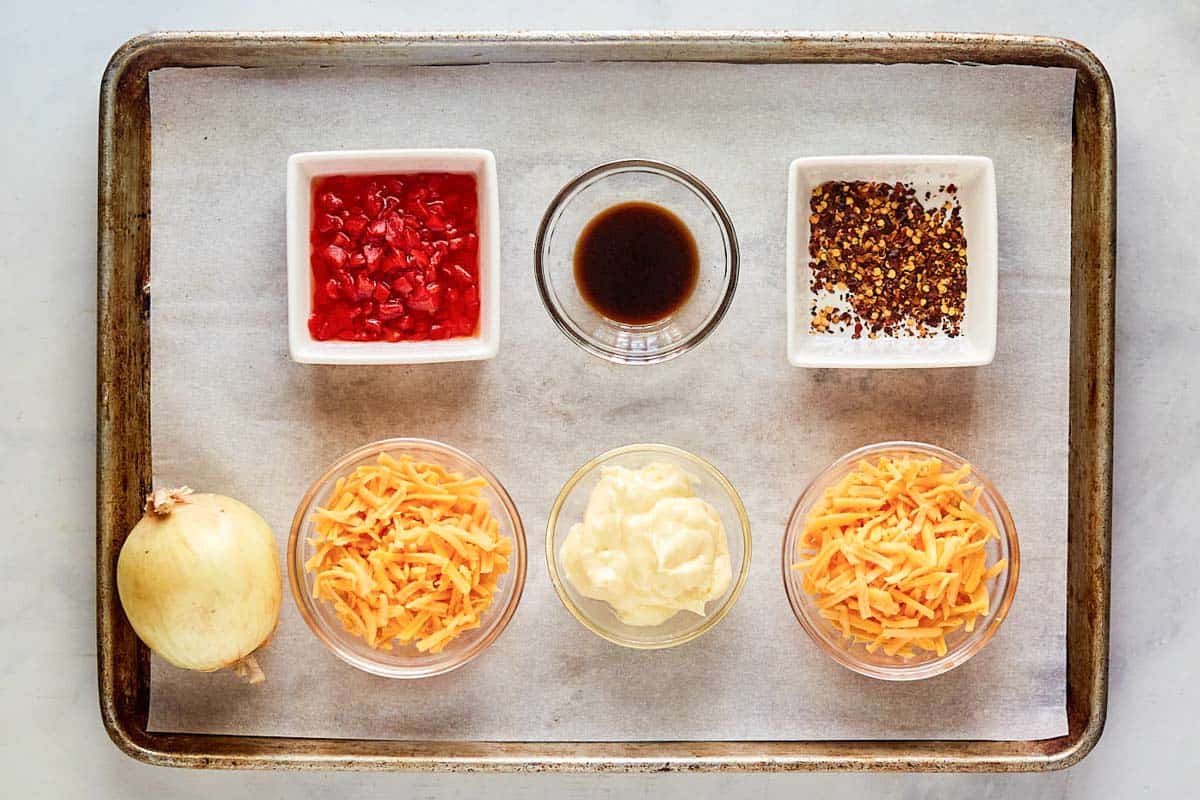 Hot pimento cheese dip ingredients on a tray.