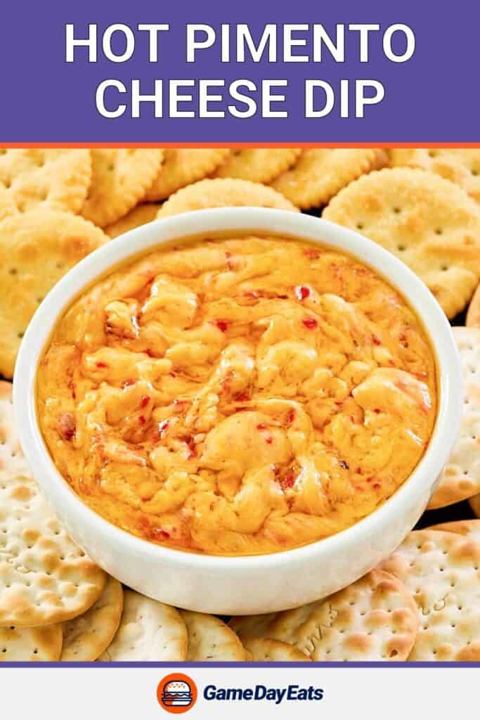 Hot pimento cheese dip in a white bowl and crackers around it.