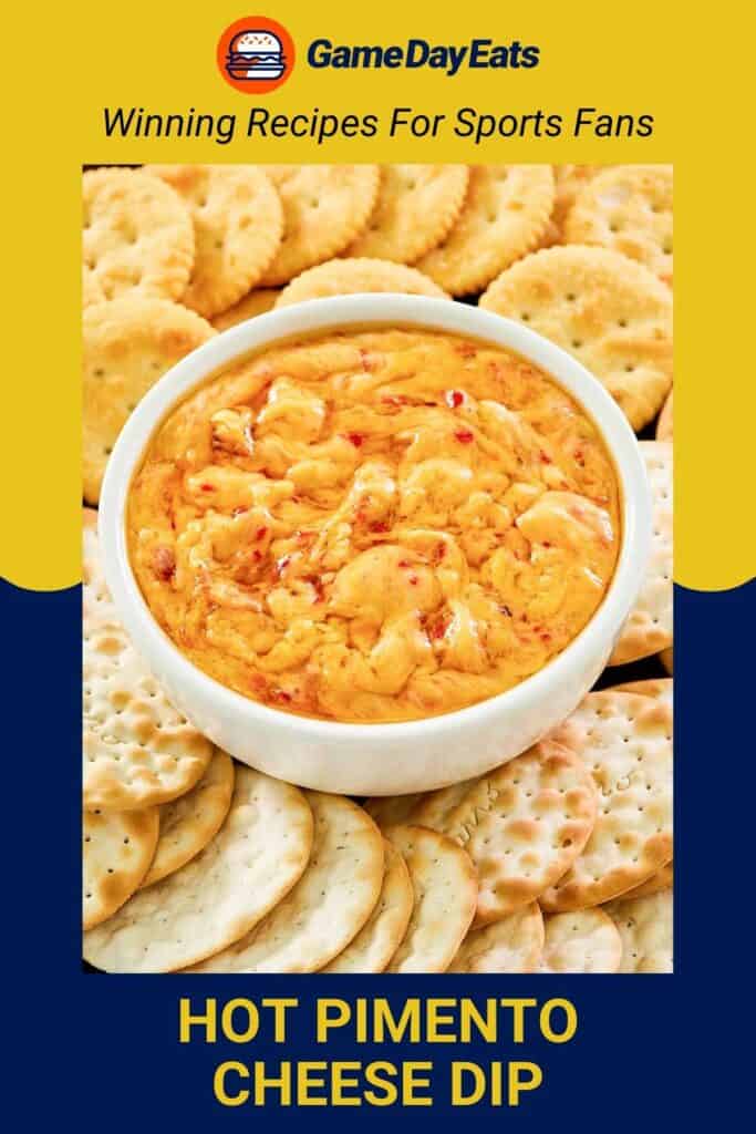 A bowl of hot pimento cheese dip and crackers around it.