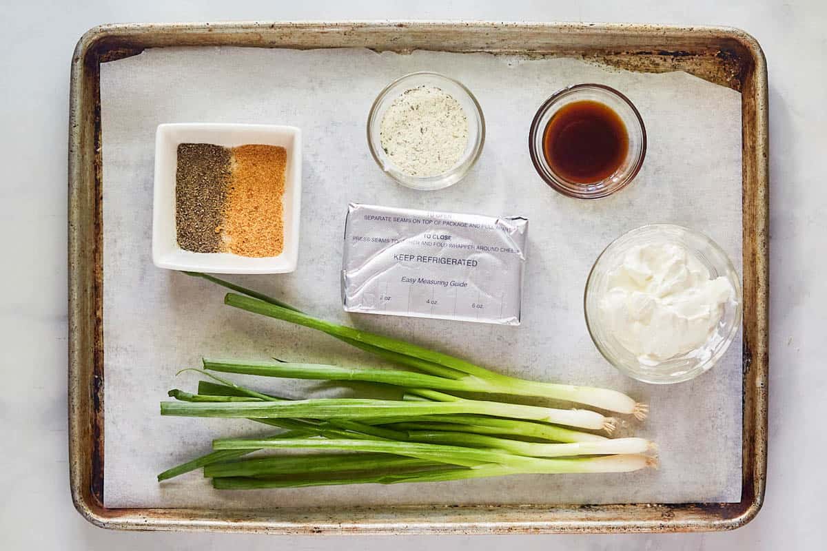 Green onion dip ingredients on a tray.