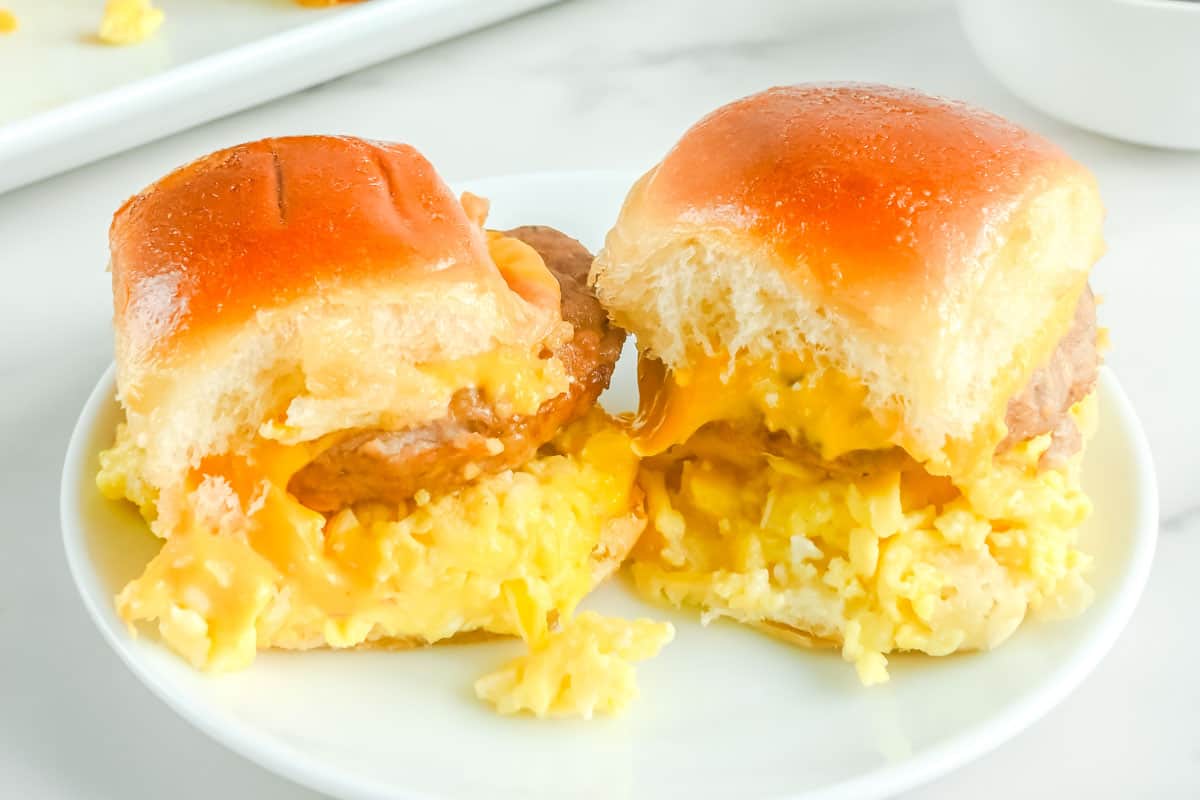 Two Hawaiian roll breakfast sliders on a plate.