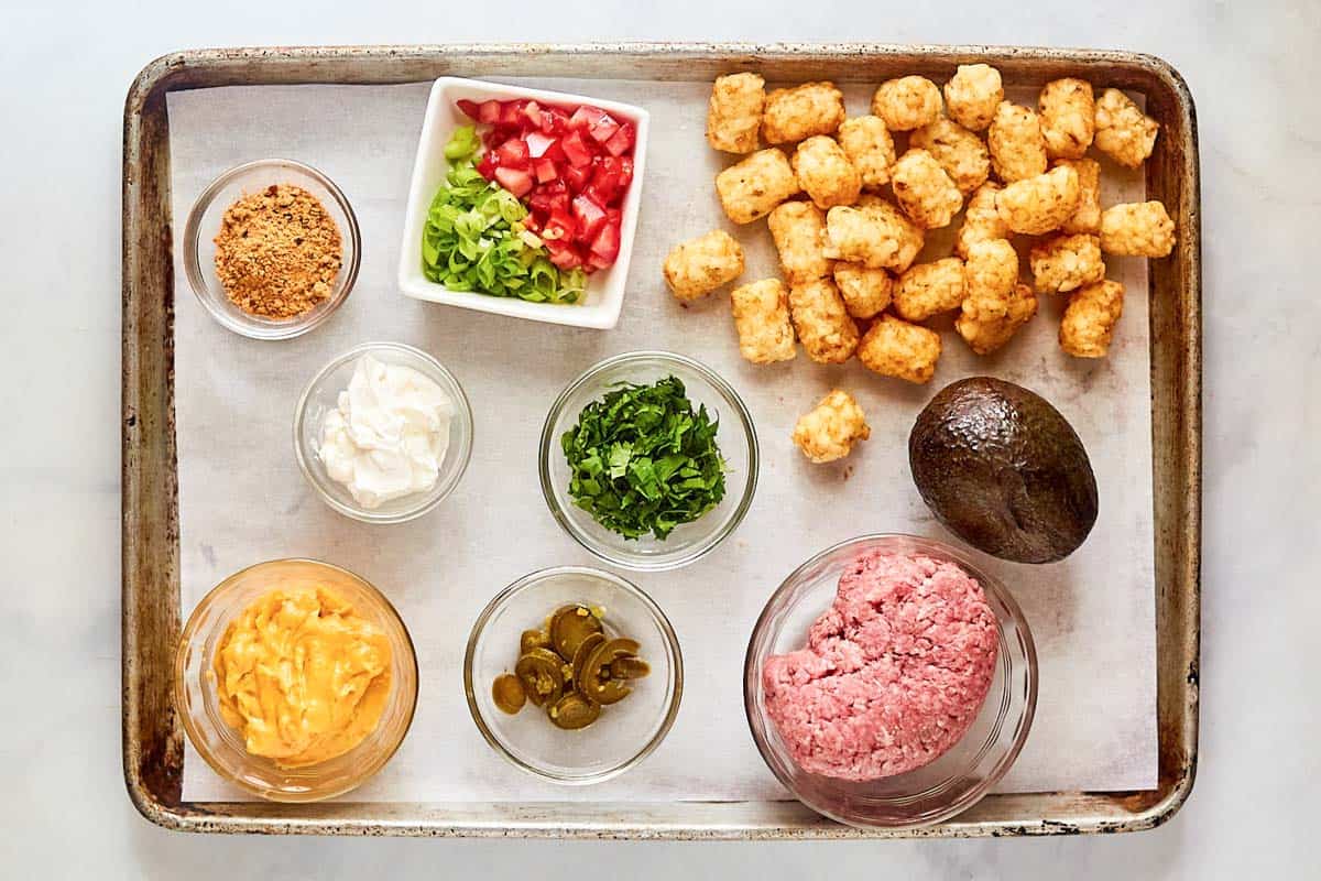 Beef totchos ingredients on a tray.