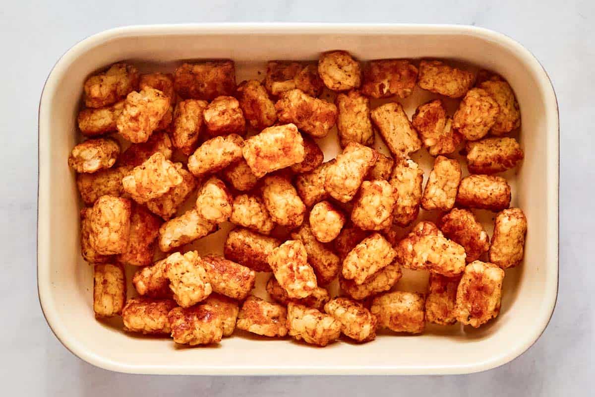 Tater tots in a baking dish.