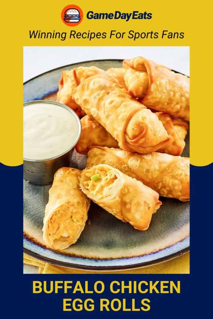 Buffalo chicken egg rolls and a cup of dipping sauce on a plate.
