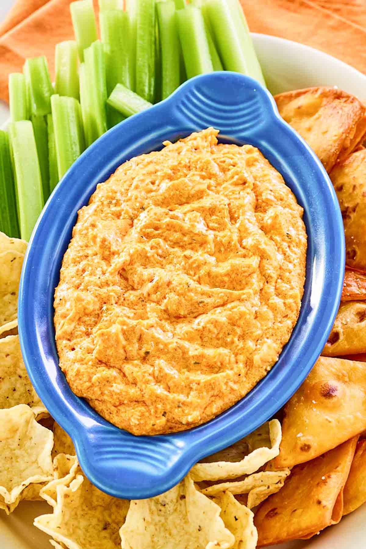 Copycat Hooters Buffalo chicken dip and assorted dippers around it.