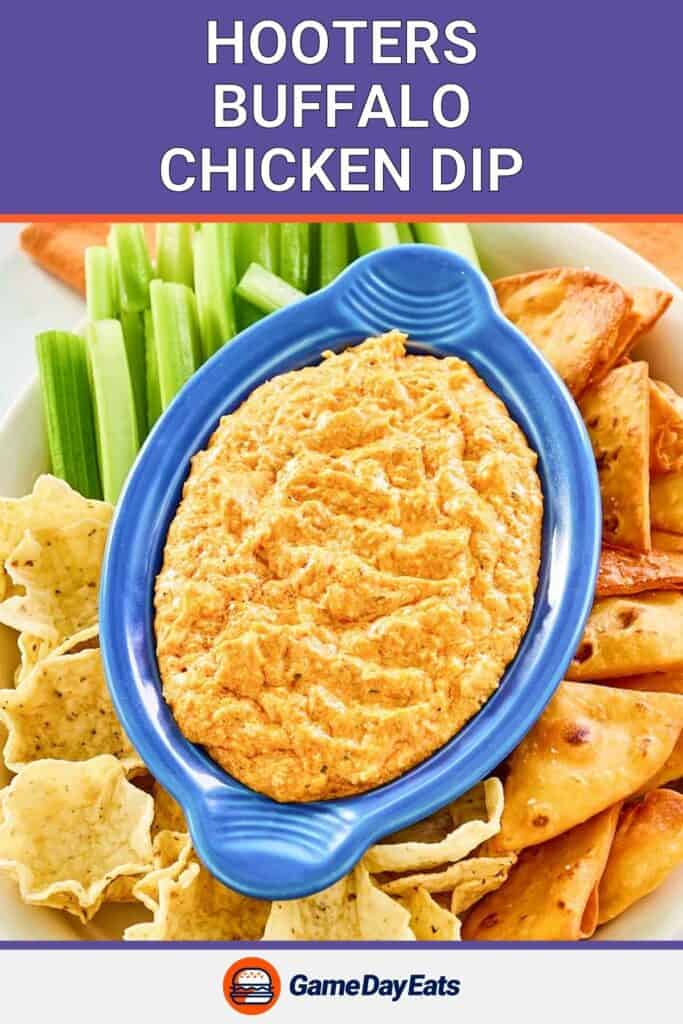 Homemade Hooters Buffalo chicken dip and assorted dippers around it.