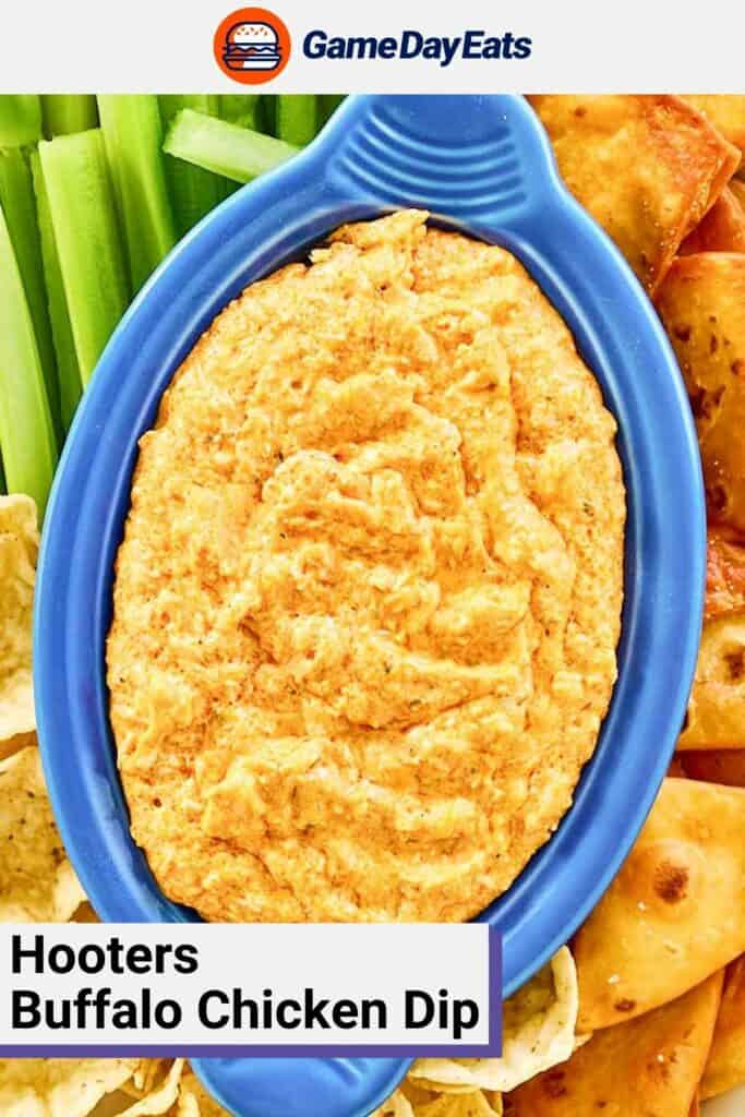 Homemade Hooters Buffalo chicken dip in a blue serving dish.