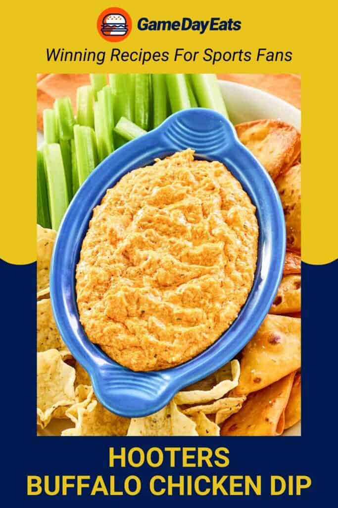 Homemade Hooters Buffalo chicken dip on a platter with chips and crackers.