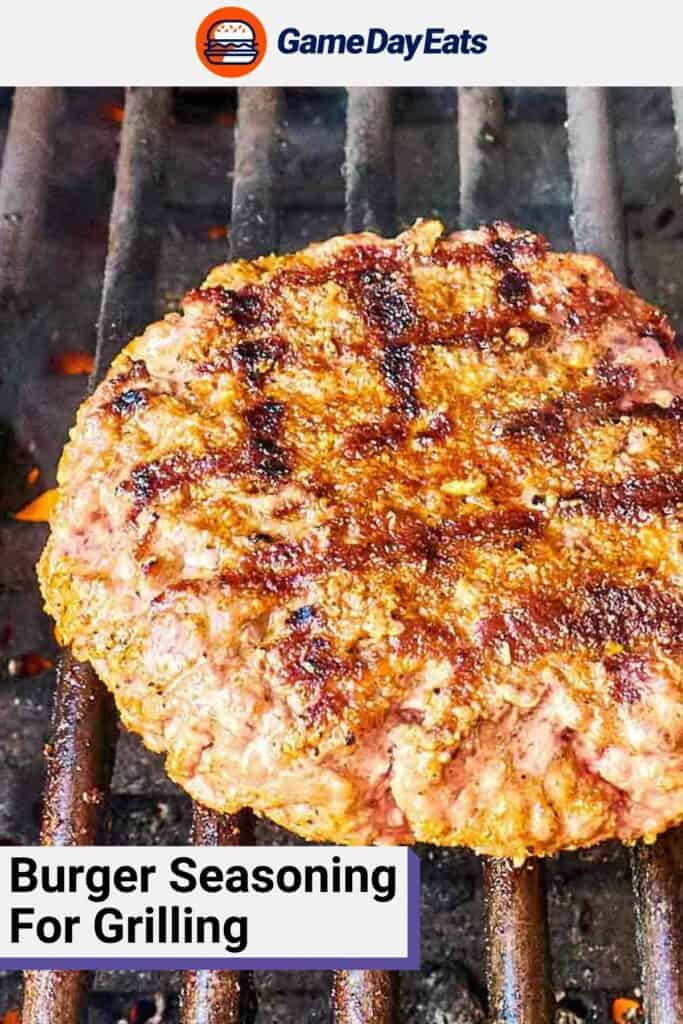 Grilled burger patty on a grill grate.