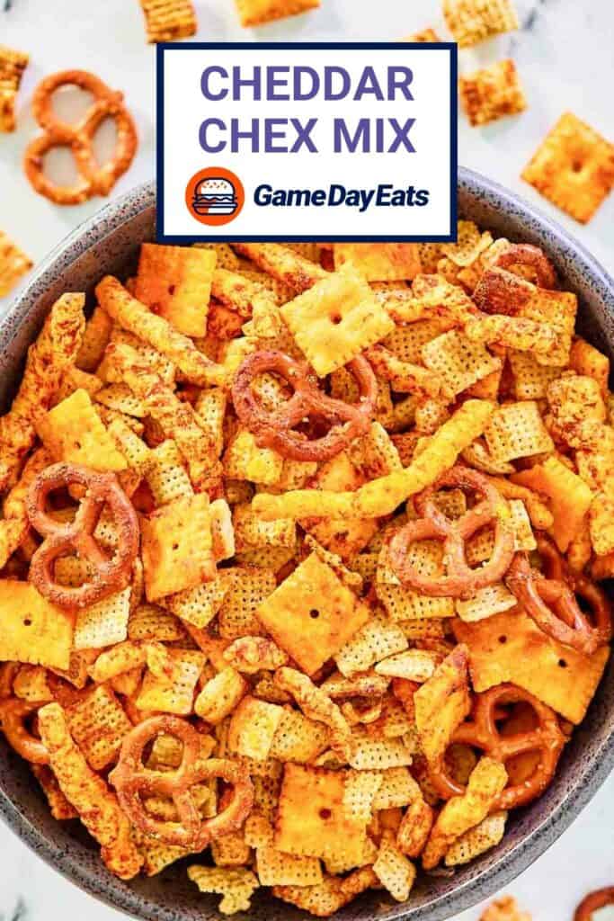 A large bowl filled with cheddar Chex mix.