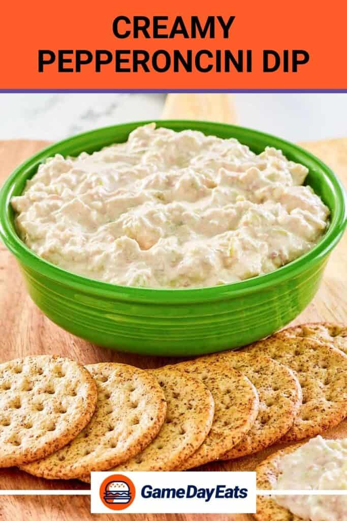 Pepperoncini dip in a bowl and crackers in front of it.