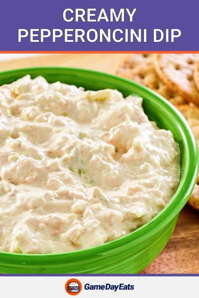 Creamy pepperoncini dip in a bowl and crackers beside it.