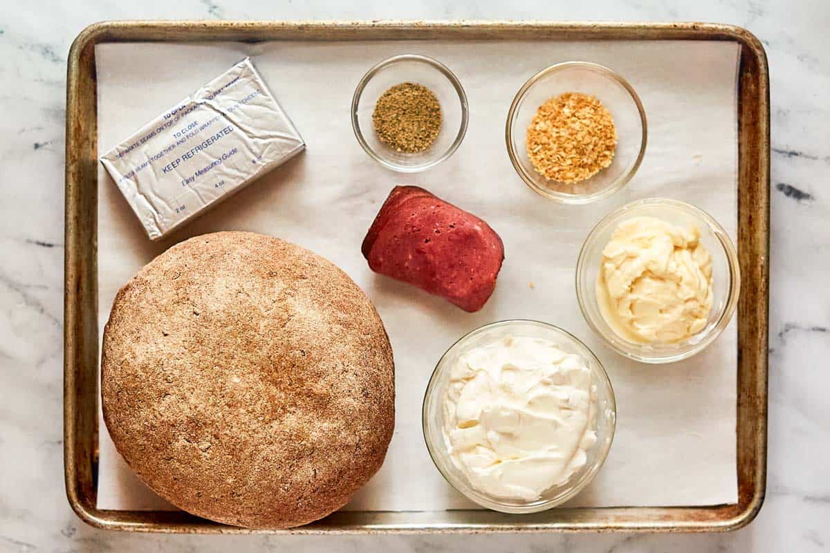 Rye bread dip ingredients on a tray.