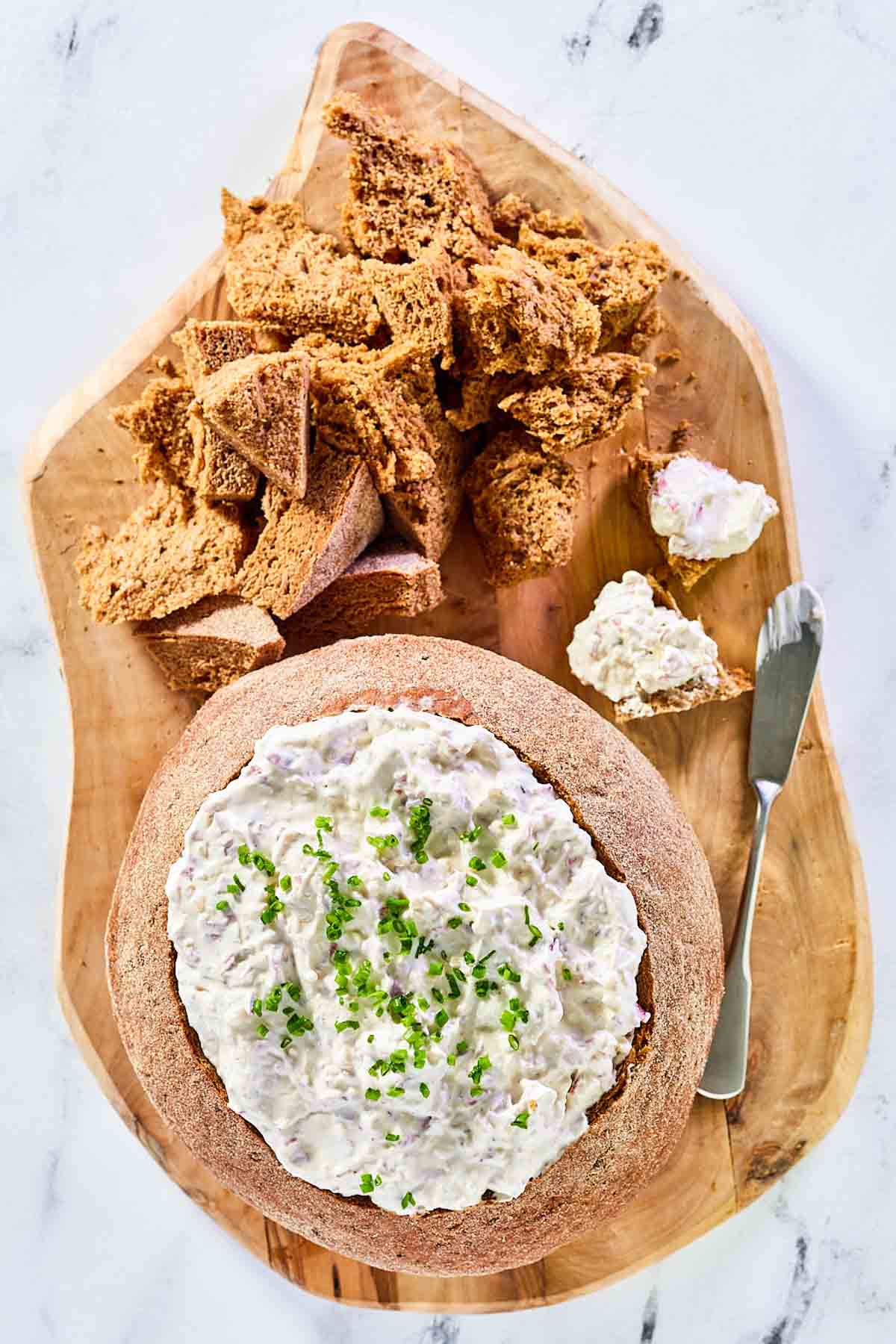 Rye bread dip and rye bread pieces on a serving platter.