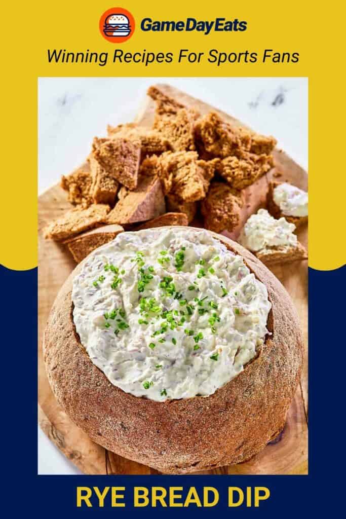 Rye bread dip in a bread bowl and bread pieces beside it.
