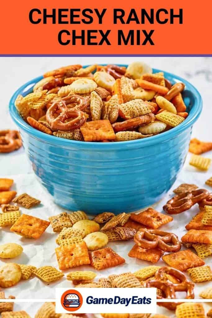 Cheese ranch chex mix on parchment paper and in a bowl.