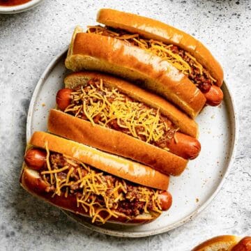 Hot dog chili on hot dogs on a plate.