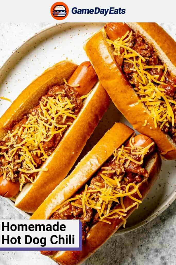 Hot dog chili and cheese on top of three hot dogs.