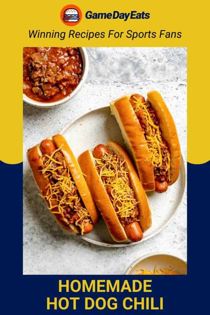 A plate of hot dogs topped with chili and cheese.