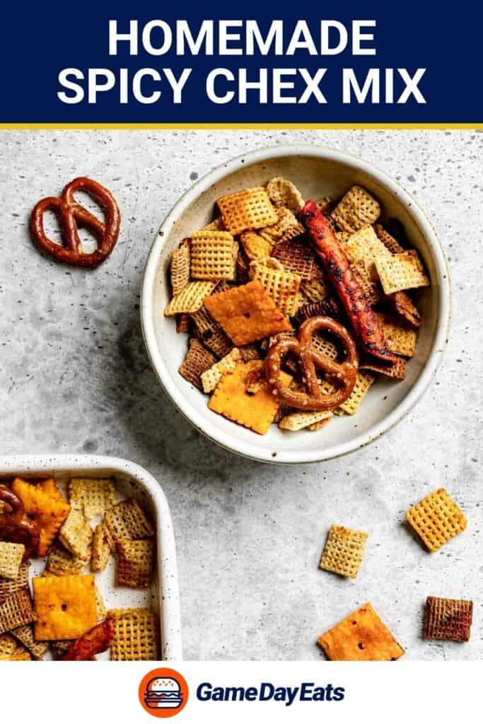 Homemade spicy Chex mix in a a bowl on a marble surface.
