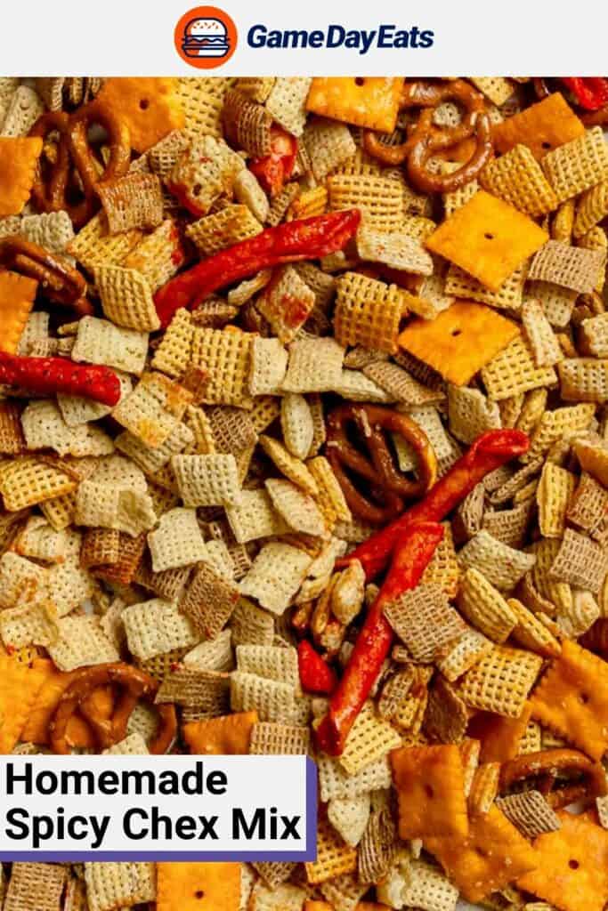 Homemade spicy Chex mix scattered on a baking pan.