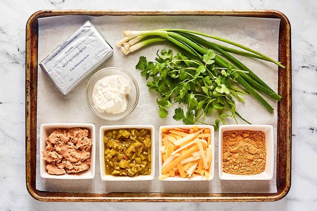Texas trash dip ingredients on a tray.