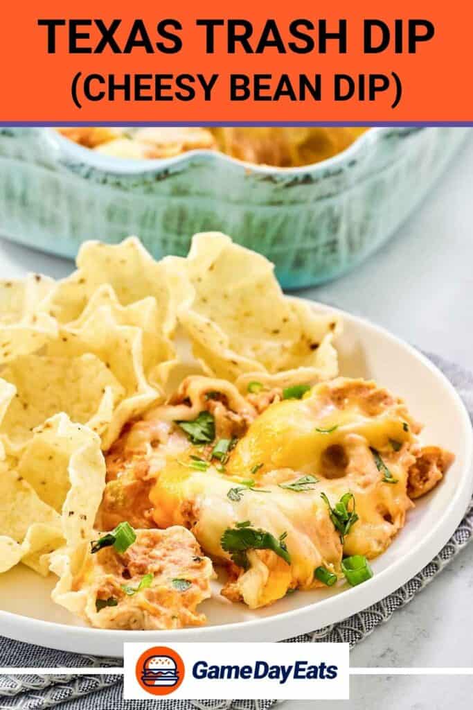 Texas trash dip on a plate with scoops tortilla chips.