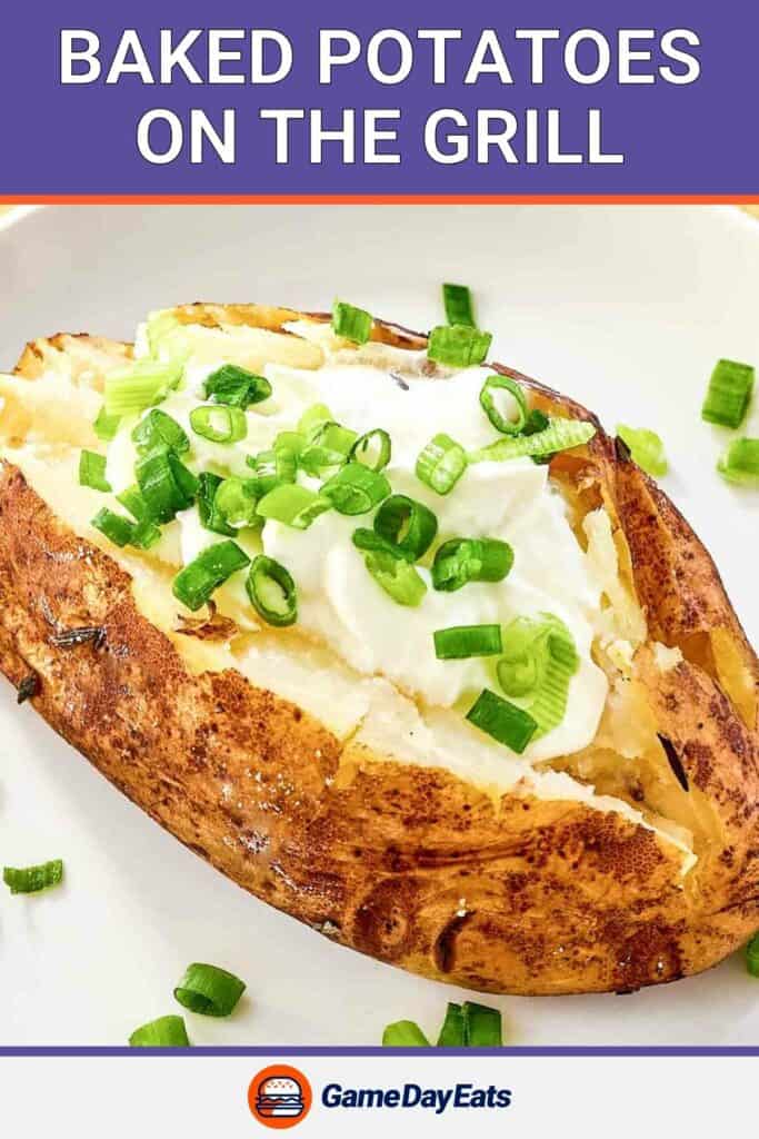 Grilled baked potato with sour cream and chives on top.