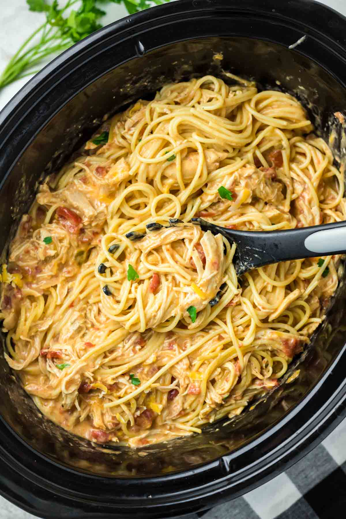 Chicken spaghetti in a crockpot.